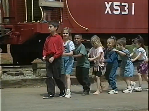 Children Standing in a Big Line